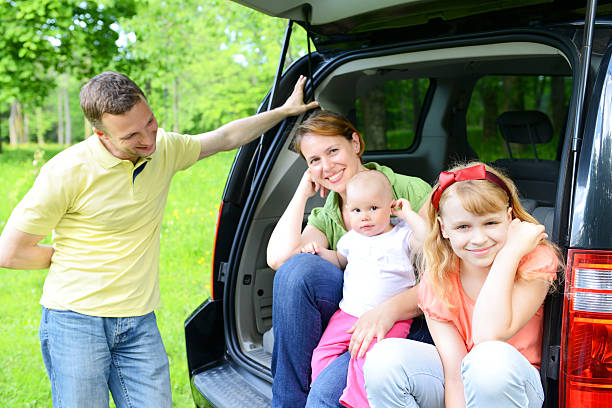 istock happy family traveling by car 453143783