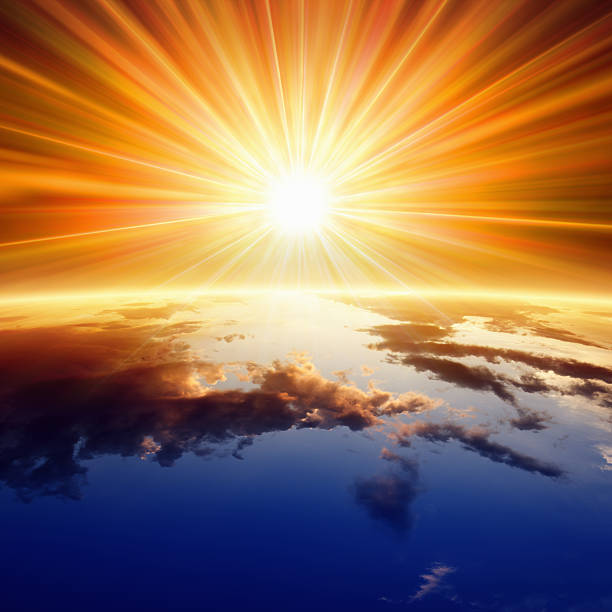 Sun above Earth stock photo