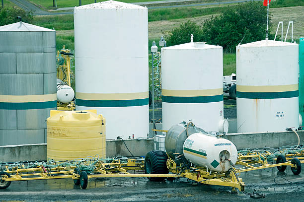 Containers of chemicals for fertilizer mix on farm Containers containing chemicals for fertilizer mix on farm in eastern Washington ammonia fertilizer stock pictures, royalty-free photos & images