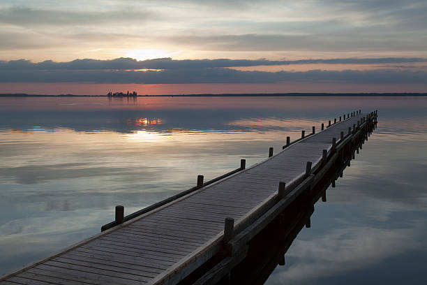 istock Idyllic dusk scenics with jetty at lake 453156323