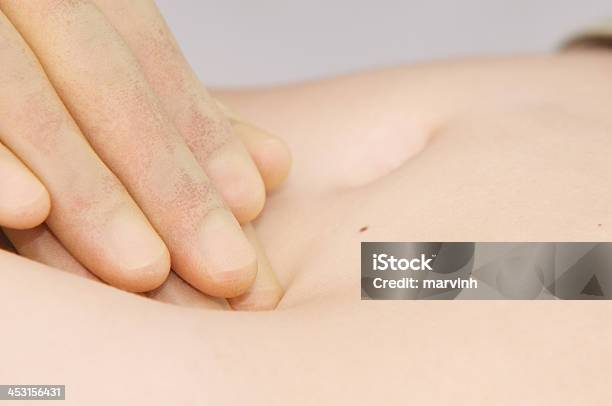 Palpation Of Young Womans Stomach Stock Photo - Download Image Now - Abdomen, Adult, Belly Button