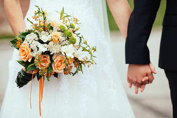 istock Bride and Groom with wedding bouquet. 453157099