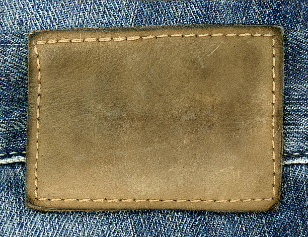 leder-aufnäher - leather patch denim jeans stock-fotos und bilder