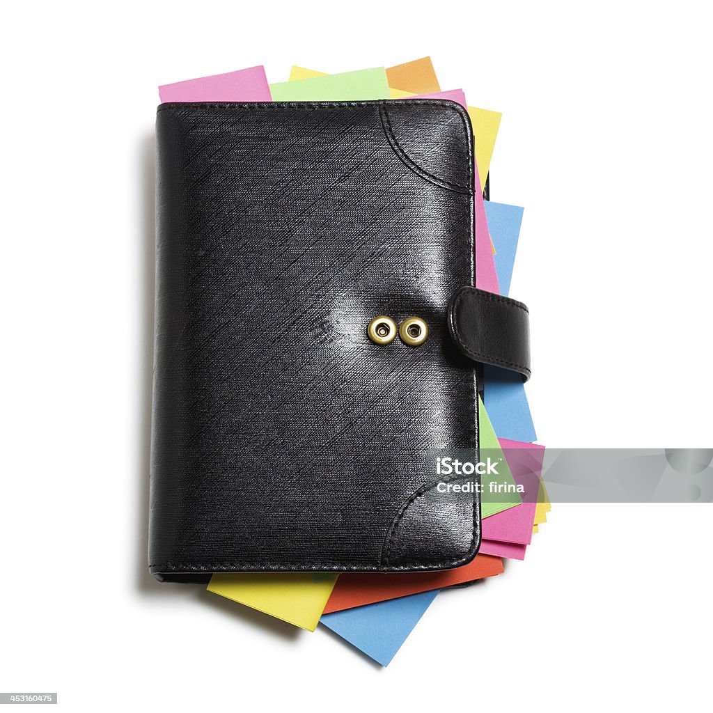 Black Notebook Black notebook with colorful note papers on white background, clipping path included Black Color Stock Photo