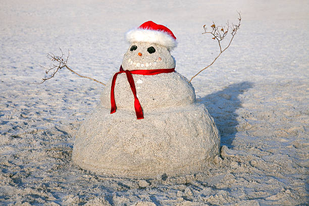 Chiristmas in Florida Chiristmas in Florida - SandMan on th beach florida christmas stock pictures, royalty-free photos & images