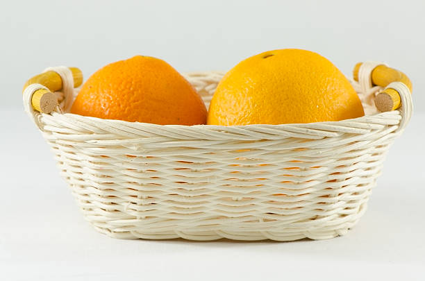 Orange in bastket stock photo
