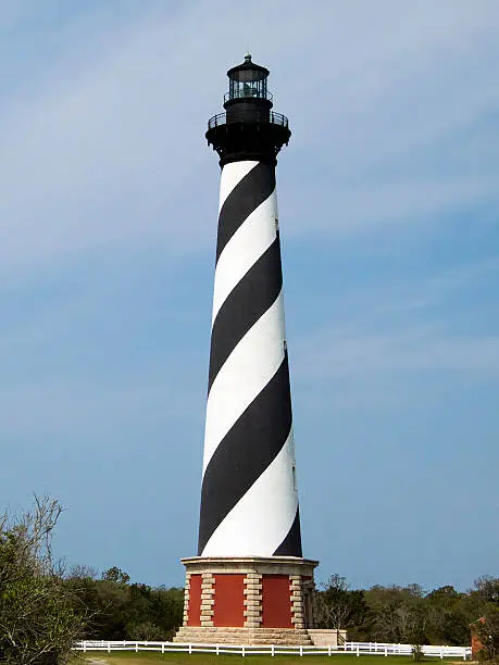 The Cape Hatteras Lighthouse in Cape Hatteras National Seashore on North Carolina's Outer Banks stands tall with it's black and white swirl paint scheme.