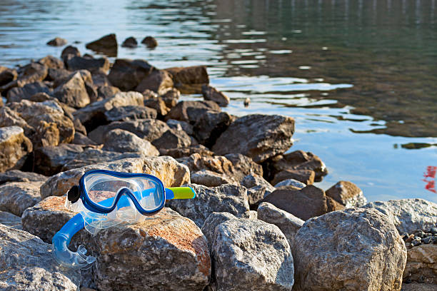 Snorkeling mask at sea stock photo