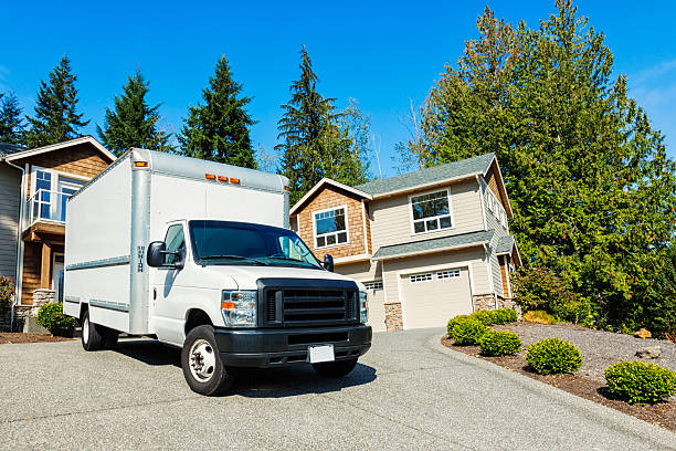 istock Plain White Moving Truck in Driveway 453167237