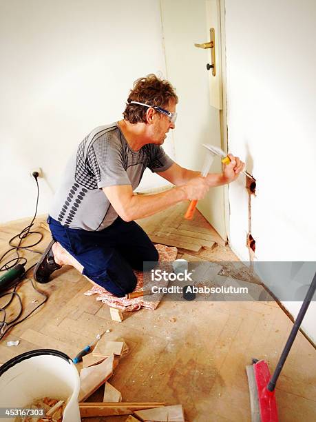 Man Making New Plugs During Home Addition Stock Photo - Download Image Now - Active Lifestyle, Active Seniors, Activity