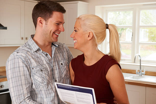 istock Young Couple Looking At Details For New Home 453167727