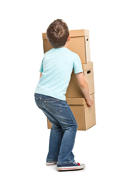 portrait of small boy with boxes