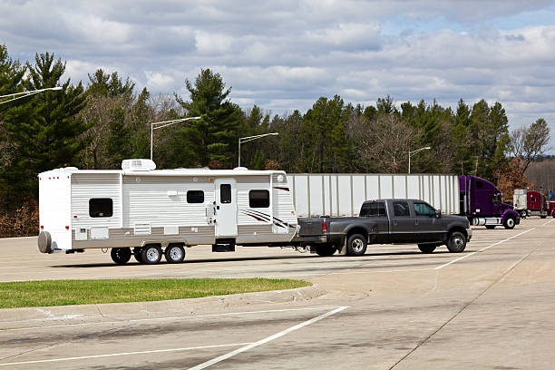 a powerful truck with a travel trailer in tow