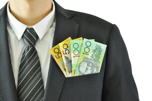 Money in businessman suit pocket - Australian Dollar bills