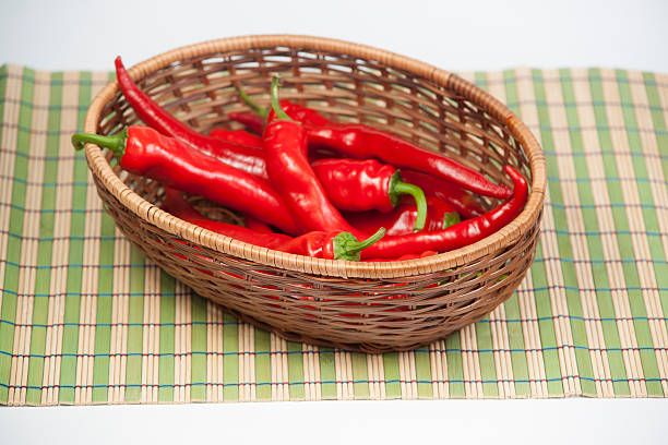 istock Red hot chili pepper in braiding basket 453172501