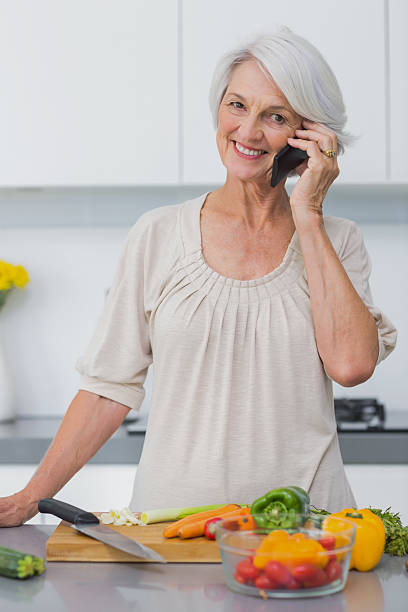 istock Mature woman preparing vegetables and calling someone 453173591