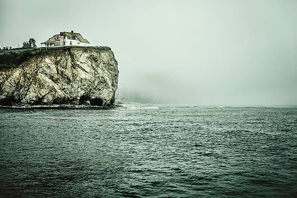 House on a cliff, facing Atlantic Ocean. Percé, Québec, Canada.