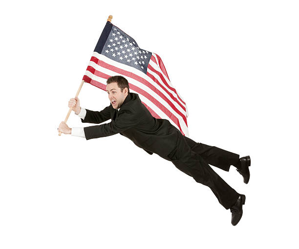 istock Young businessman flying with an American flag 453177817