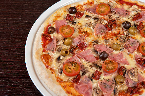 istock pizza with ham and mushrooms 453181965