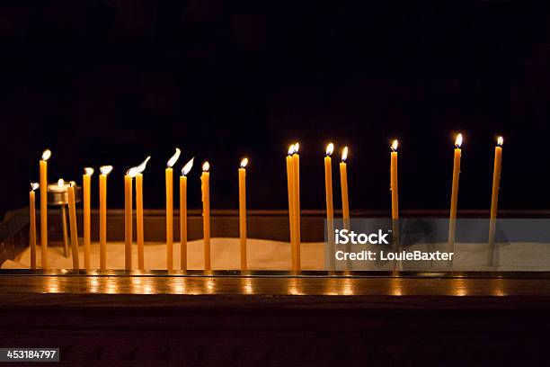 Religious Candles In Darkness Stock Photo - Download Image Now - Backgrounds, Beeswax, Black Background