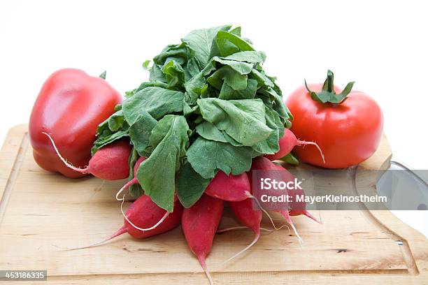 Radishes And Tomatoes With Paprika Stock Photo - Download Image Now - Bell Pepper, Cutting Board, Food and Drink