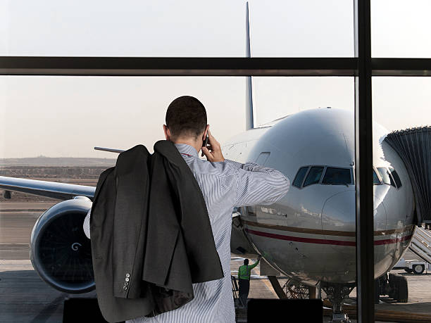 istock Businessman back turned talking by phone 453191149