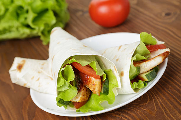 istock wheat tortilla with chicken and vegetables 453192219