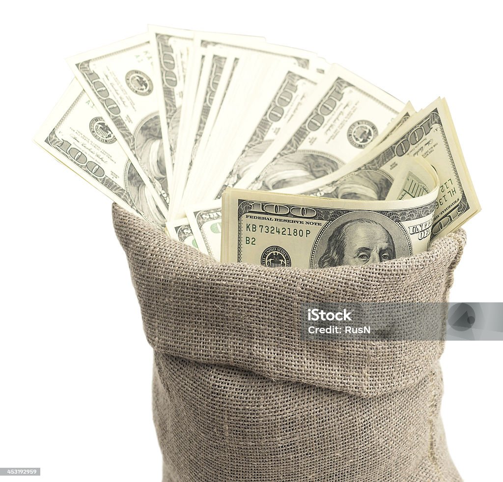 Dollars money in burlap sack isolated on white Abundance Stock Photo