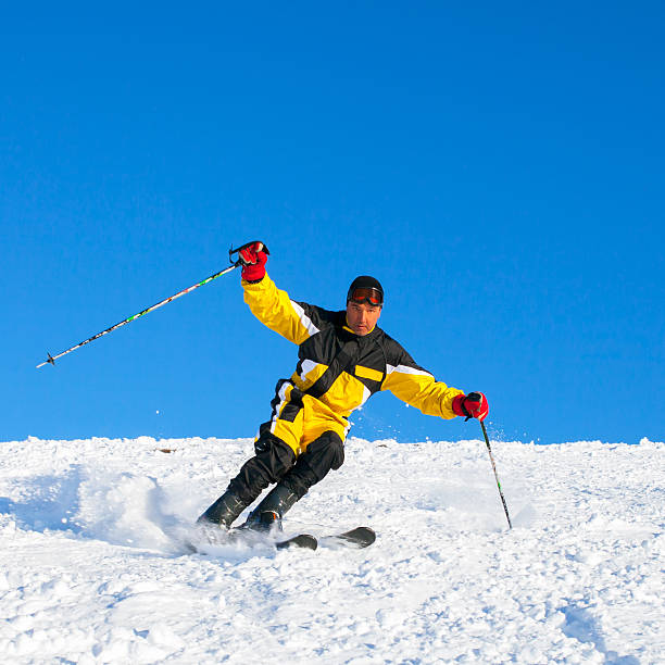 istock sportsman skiing in front of mountain 453193659