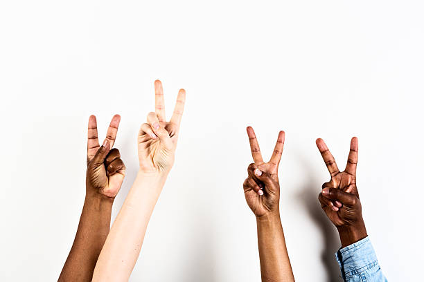 istock Four mixed hands signal V for victory or peace 453193671
