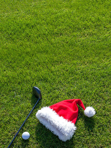 Christmas hat and golf equipment stock photo