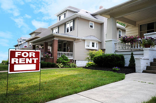 Home For Rent Sign Home For Rent Sign in Front of Beautiful American Home house rental stock pictures, royalty-free photos & images