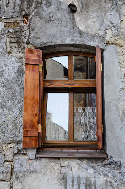 istock Wooden window on an old degraded wall 453195627