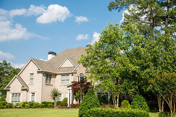 istock Brick Home with Landscaped Lawn under Nice Skies 453197621