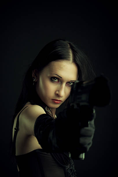 istock Girl with gun 453198017