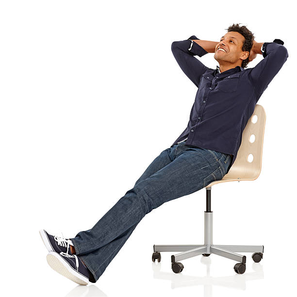 istock Happy middle aged African guy sitting relaxed on chair 453199791