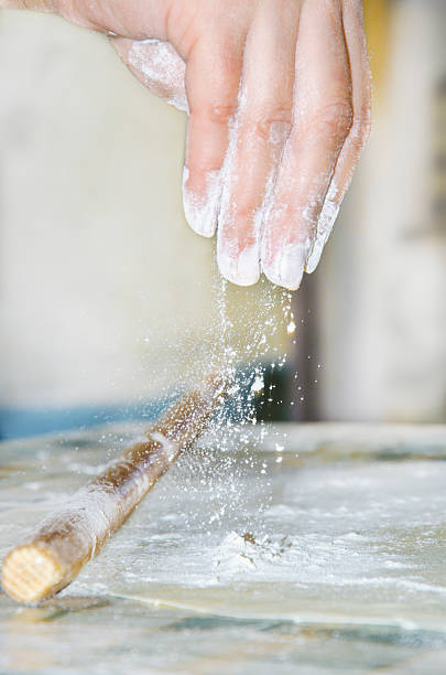 istock woman makes and prepares pastry in a bakery kitchen 453203571