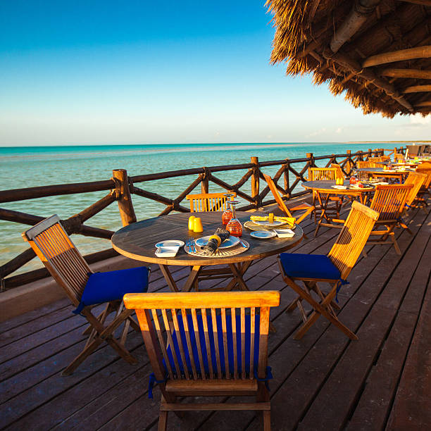 istock Summer empty open air restaraunt near sea at sunset 453205415
