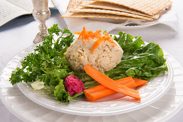 istock Gefilte Fish with Kidduch Cup, Matzah and Haggadah 453209065