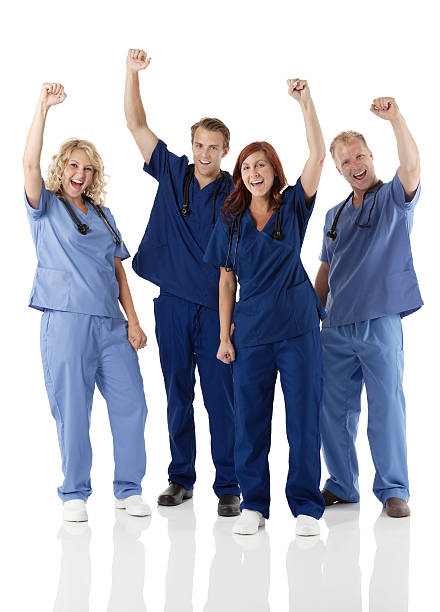 Cheerful physician and nurse Cheerful physician and nursehttp://www.twodozendesign.info/i/1.png cheering group of people success looking at camera stock pictures, royalty-free photos & images