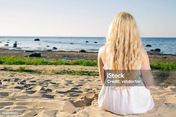 Dreaming Woman In White Dress On Beach Stock Photo - Download Image Now - Adult, Beach, Beach Holiday