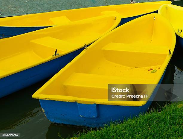 Yellow Row Boats In A River Stock Photo - Download Image Now - Anchored, At The Edge Of, Autumn