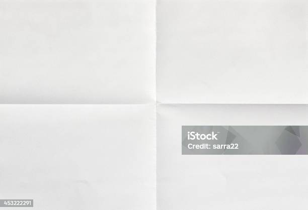 White Sheet Of Paper In Four Stockfoto en meer beelden van Papier - Papier, Gevouwen, Textuur