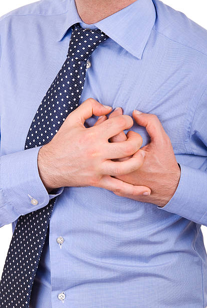istock Businessman with heart attack. 453222731
