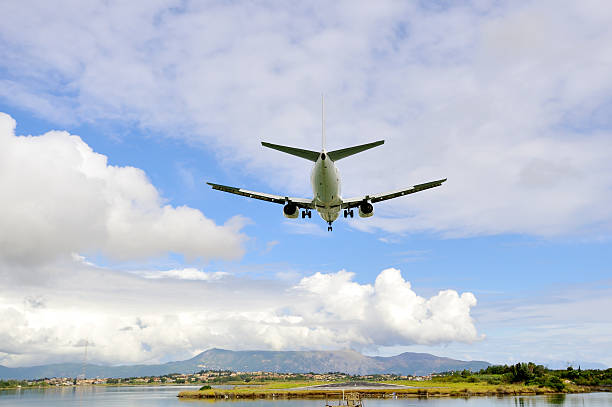 istock Passenger airplane landing to active runway 453223009