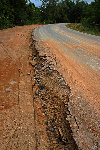 The road begins collapse. The road begins collapse. trafficcrack stock pictures, royalty-free photos & images