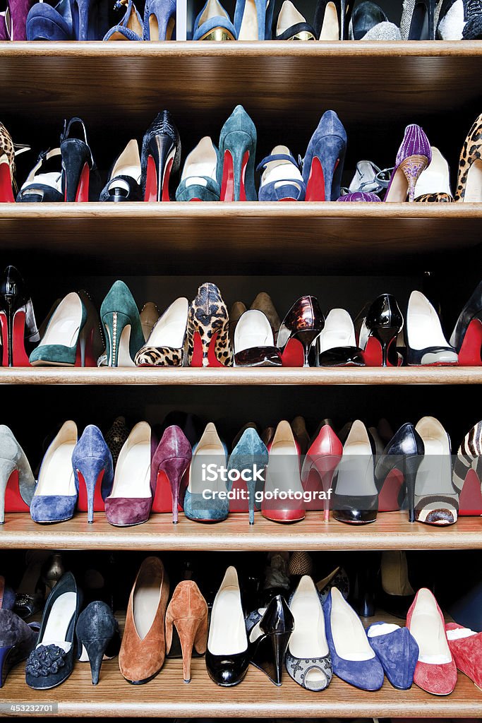 Shoes Collection A collection of shoes organized neatly along shelves in a shoes closet. Shoe Stock Photo