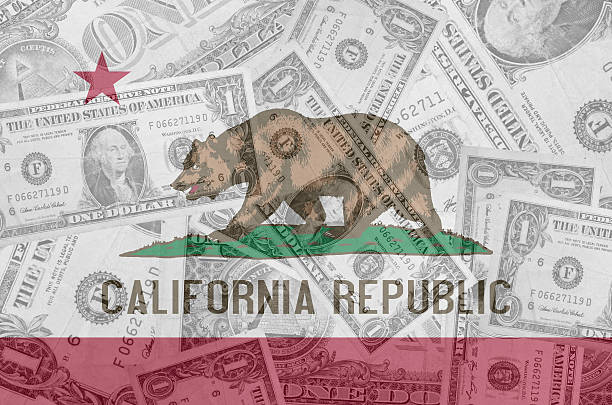 US state of california flag with transparent dollar banknotes stock photo