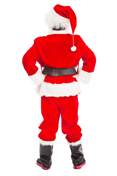istock merry Christmas Santa Claus standing and back view 453236263