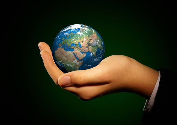 istock Hand of the person holds globe. 453237867